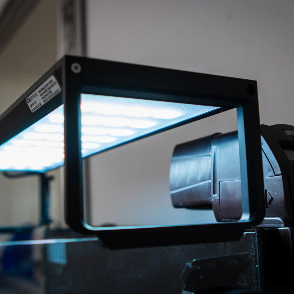 Side angle of the AT5S programmable LED light fitted over an aquarium