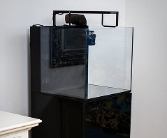 Black glass marine aquarium and cabinet with automated filtration system